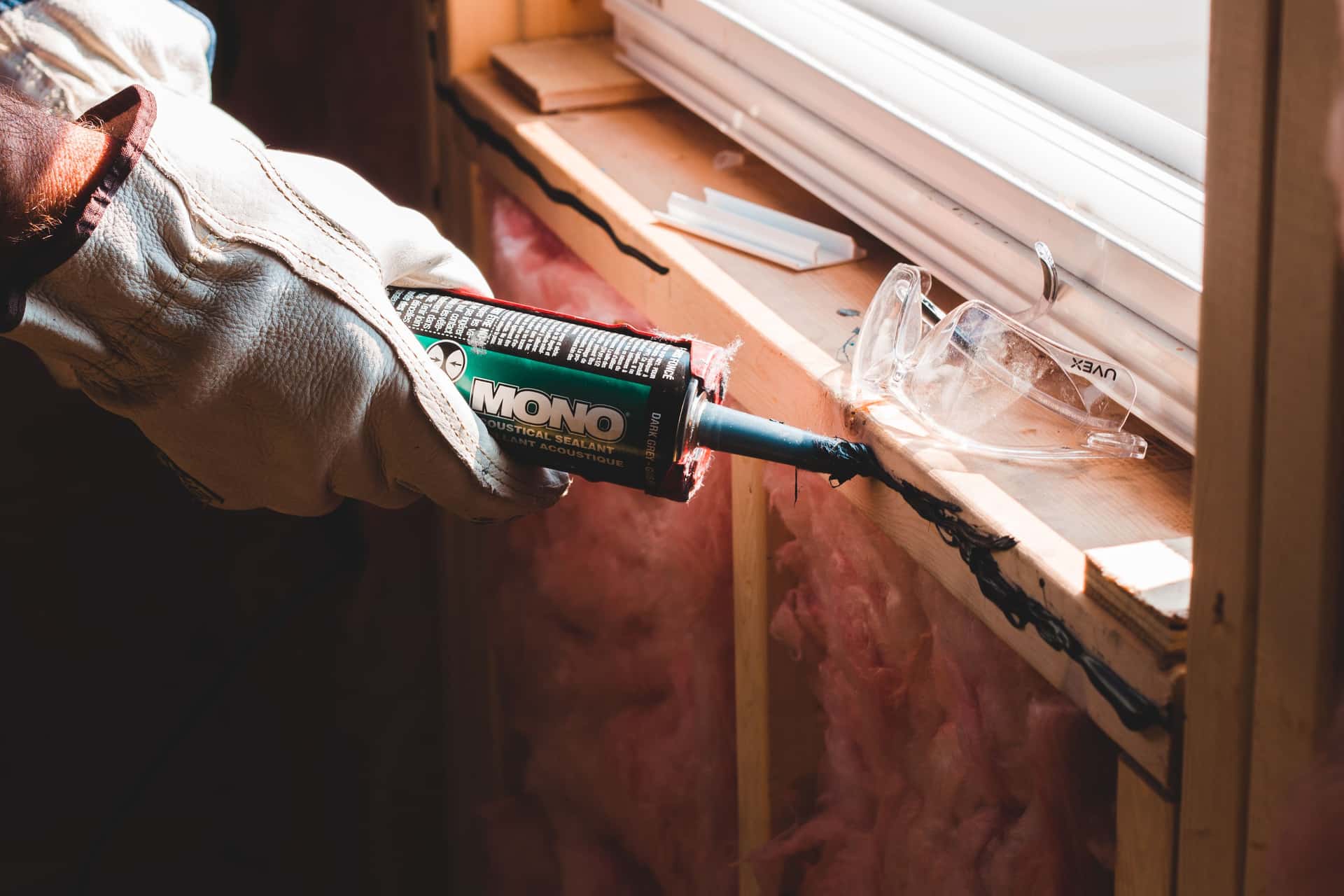 Sealant being applied along a seam